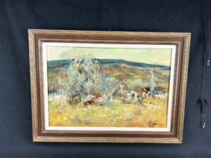 Oil painting of a vibrant rural New Mexico village landscape by American artist Dorothy Peterson, featuring adobe buildings, flowering trees, and soft mountain ridges.